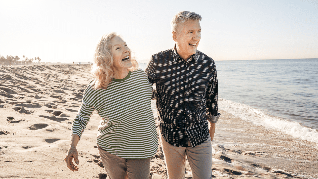 Happy retired couple enjoying their retirement with financial confidence.
