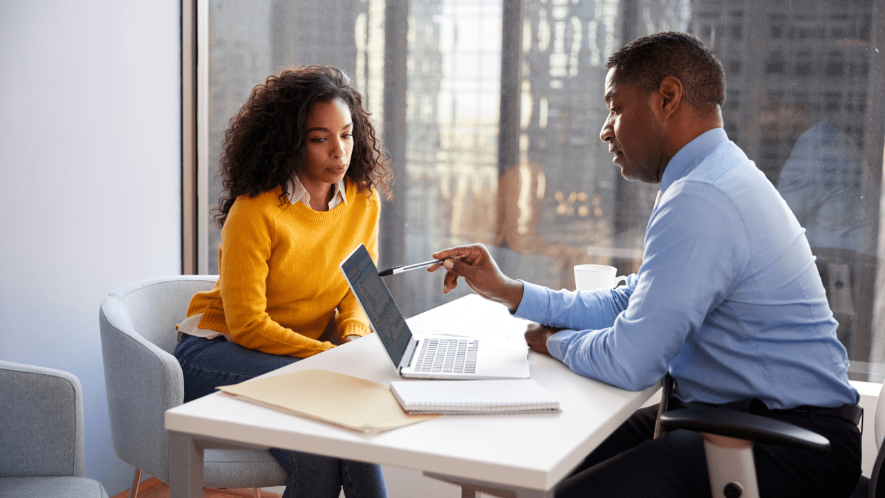 Image of a financial advisor consulting with a client about their second career financial plan at Brookstone Financial in Jeffersonville, IN.