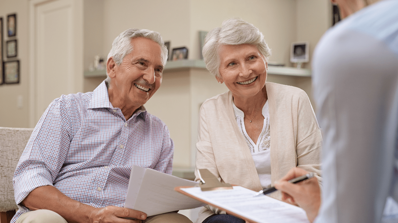 A couple in Jeffersonville, IN, reviewing retirement plans with a Brookstone Financial advisor.