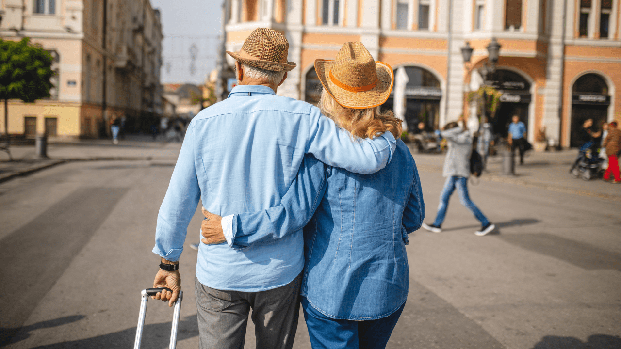 A couple celebrating their retirement journey, symbolizing long-term financial success.